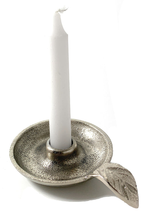 Silver aluminum taper candle holder with leaf handle shown with a white candle