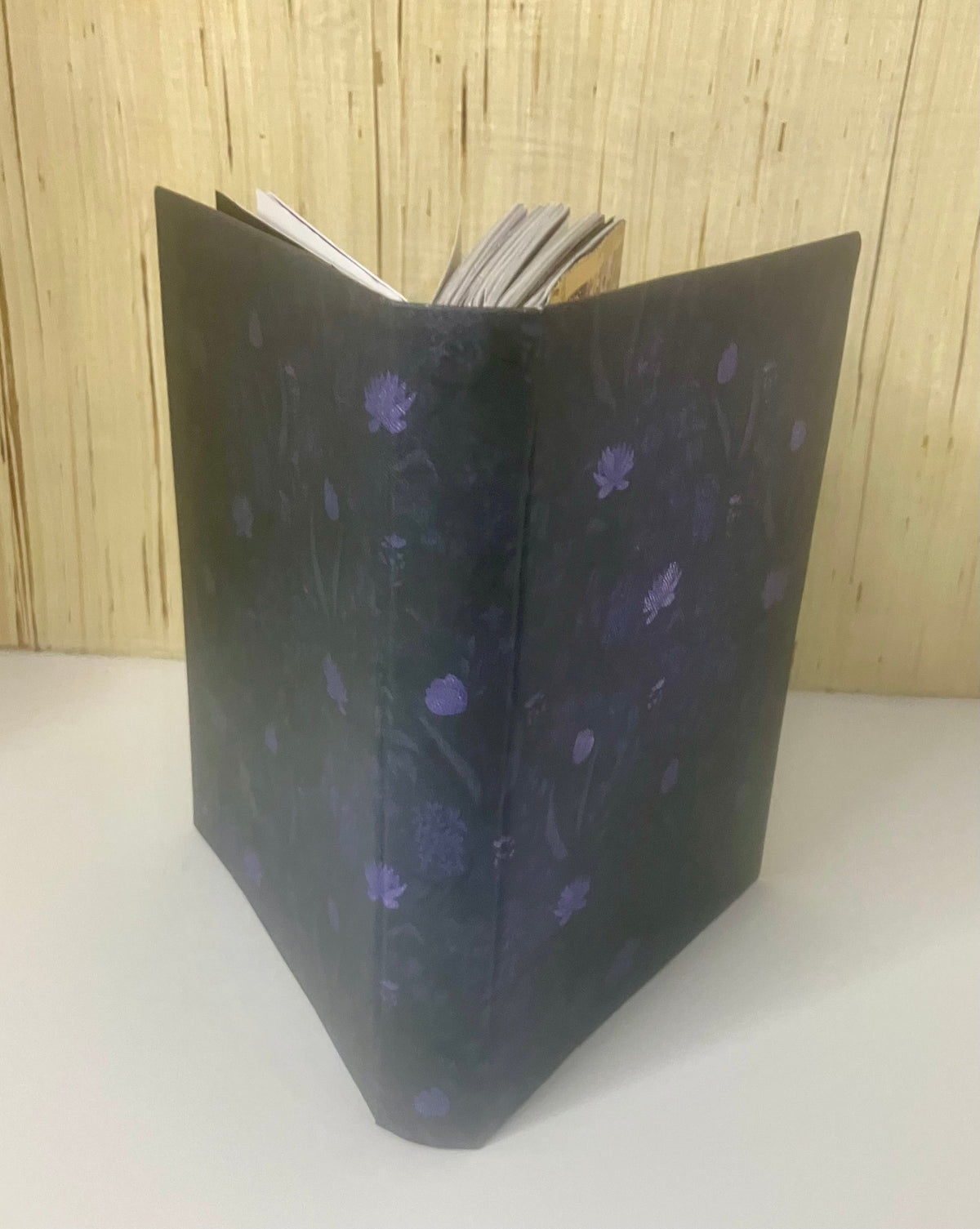 Dark journal cover with small purple flowers