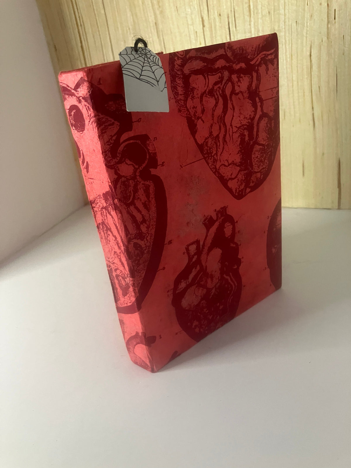 Red anatomical-heart journal showing its front cover